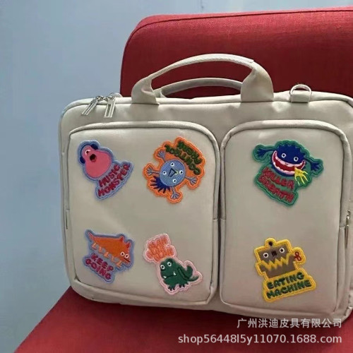 小衆設計怪物貼布筆記型電腦包斜背16英寸女電腦文件手提收納包中